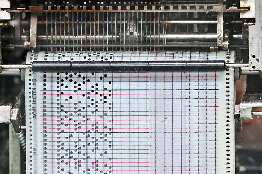 Punch card on an old machine