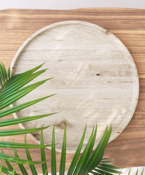 istock Top view brown wooden podium on table counter, palm tree in sunlight, leaf shadow on cream white wall 2149637315