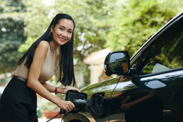 istock Woman Charging Electric Car 2149637651