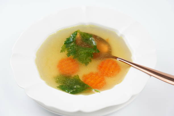 istock Chicken bouillon broth. Chicken soup,  with vegetables. 2149638245