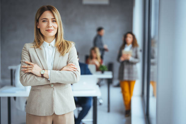 istock Successful businesswoman standing in office with copy space. 2149638654