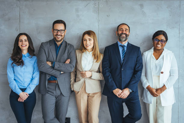 istock Business colleagues are standing against wall. 2149638796
