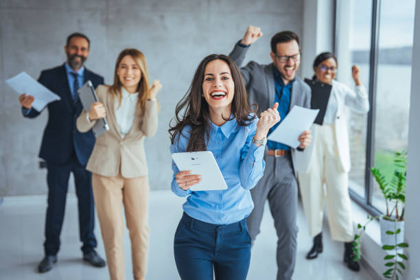 istock Business team celebrating a triumph with arms up 2149638967