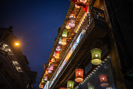 with lanterns illuminated facades in shopping street in Sapa, northern Vietnam