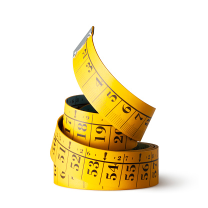 Yellow measuring tape on white background. Photo with clipping path.