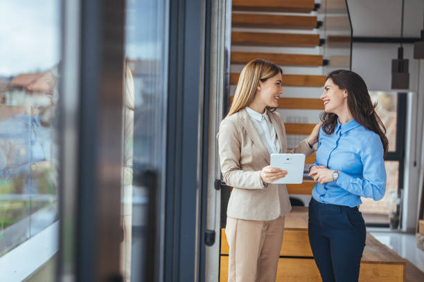 istock Two female managing directors discussing ideas of project on digital tablet 2149639229