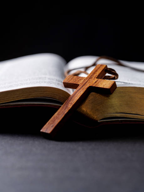 istock Wooden cross and bible on the table 2149642490