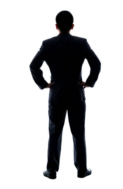 Full length. Silhouette Male African Doctor Standing With Hands In His Pockets. Professional shot in 4K resolution. 012. You can use it e.g. in your commercial video, medical, business, presentation, broadcast