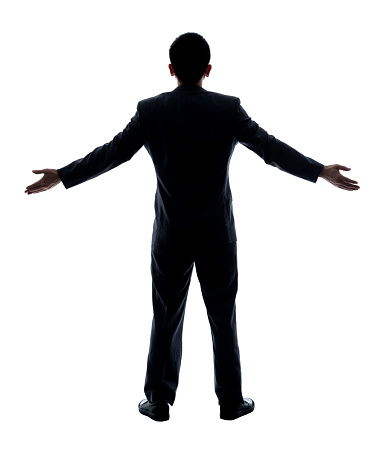 Businessman standing with arms outstretched on white background.