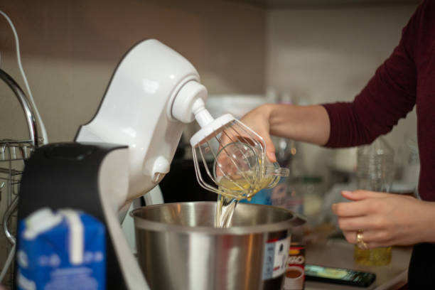 istock woman is making cake at home 2149643211