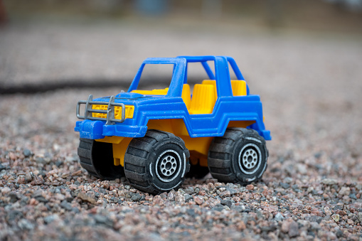 a close up of suv style toy car at playground