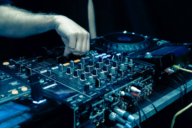 istock close up of DJ hands on dj console mixer 2149644424