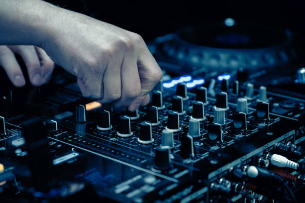 istock close up of DJ hands on dj console mixer 2149644460