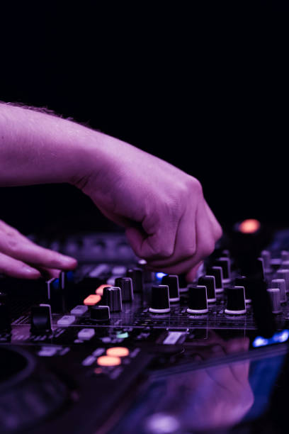 istock close up of DJ hands on dj console mixer 2149644467