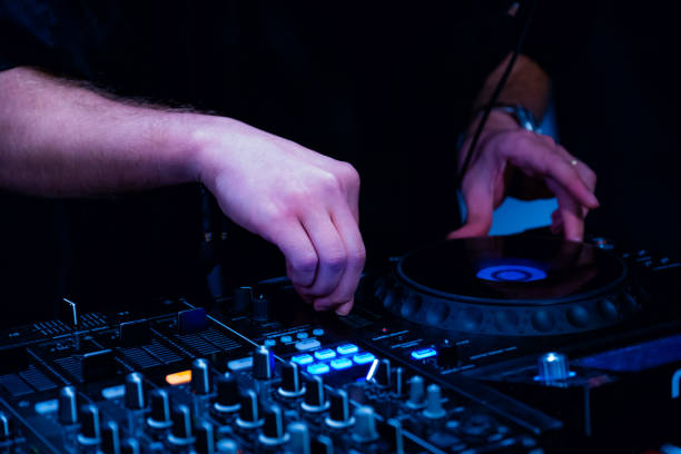 istock close up of DJ hands on dj console mixer 2149644602