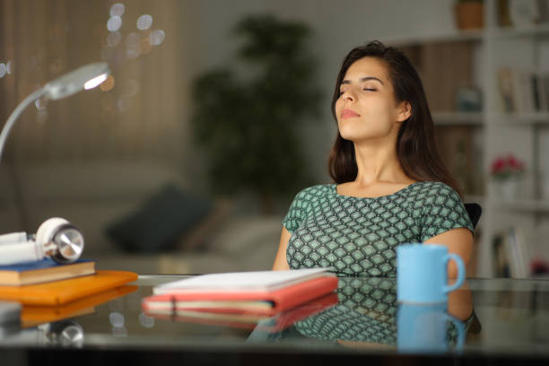 istock Student relaxing in the night breathing at home 2149644909