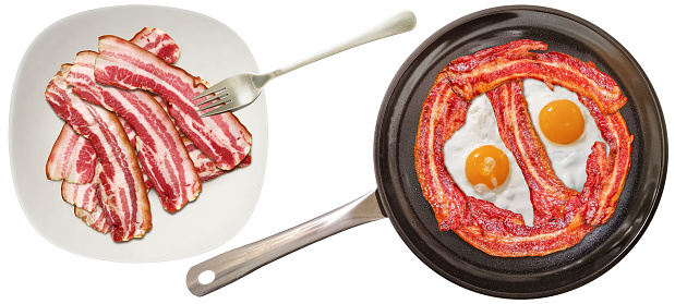 Traditional gourmet breakfast, with pair of delicious organic freshly fried Sunny side up eggs, enhanced and enriched with bunch of a crunchy fried bacon rashers, prepared in the new, modern, large, heavy duty, non-stick ceramic coated black frying pan, combined with the plateful of boiled meaty, streaky boiled pork belly bacon slices, set beside on a white ceramic plate, isolated on white background, viewed directly above, high resolution stock image.