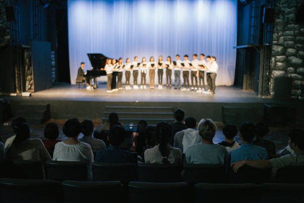 istock Asian Chinese Choir chorus performance group Singing on stage with audience watching 2149646475