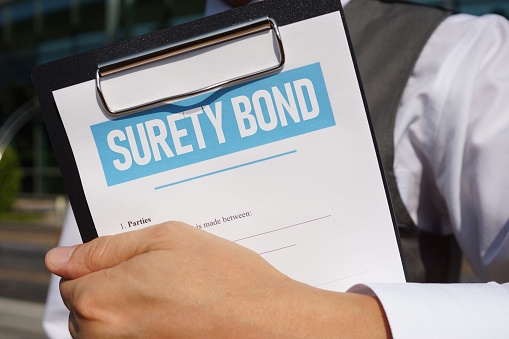 Surety bond is shown using a text on the blank