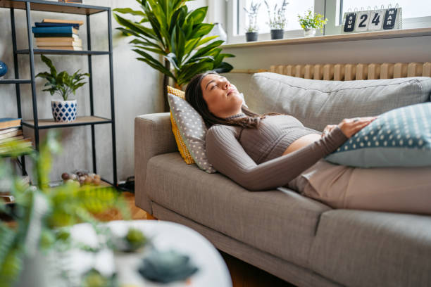 istock Young Woman Napping On The Sofa At Home 2149647677