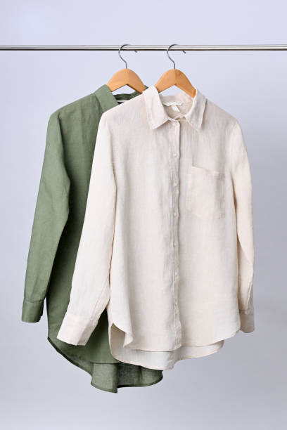 istock Linen shirts hanging on wooden hangers 2149648236
