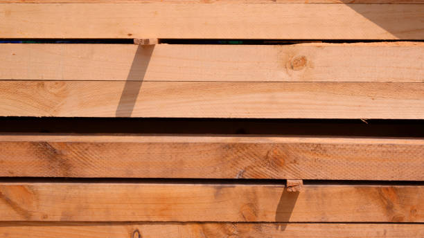 istock Group of big hardwood timbers stacked in horizontal pattern, construction material background 2149648595