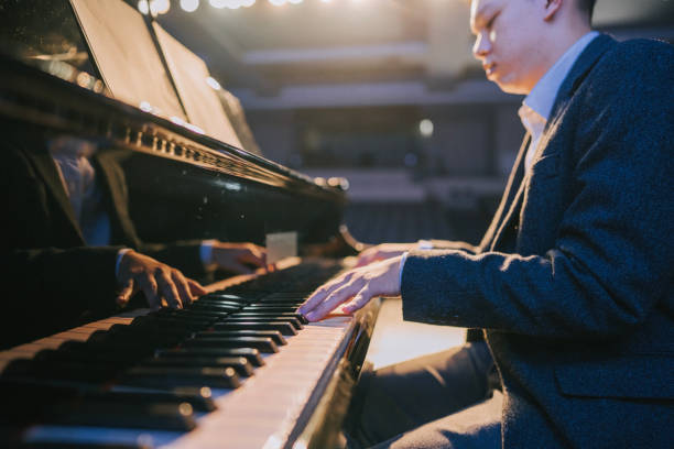 istock close up Asian talented Chinese pianist finger playing performing on stage 2149648987