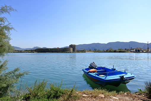 September 17 2023 - Butrint in Albania: An albanian fisherboat on Butrint lake salt lagoon