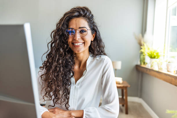 istock Successful businesswoman standing in creative office and looking at camera. 2149649618