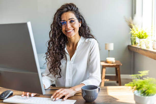 istock Successful businesswoman standing in creative office and looking at camera. 2149649619