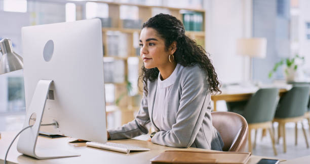 istock Business, office and woman with a computer, thinking and internet with connection, typing and online reading. Person, worker and employee in a workplace, pc or company website with information or app 2149651514