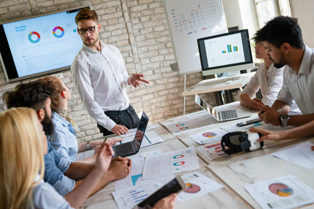 istock Team of young creative marketing business experts brainstorming during work at startup office 2149653324