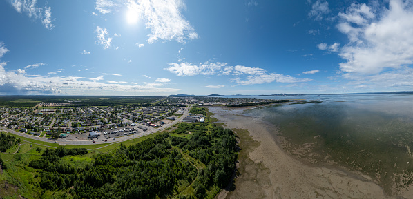 Aerial view of Sept-iles, Cote-Nord, Quebec, Canada. View of the city and the St. Lawrence river during summer.