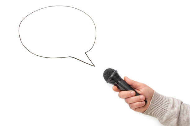 Male arm holding a black microphone next to a speech bubble, isolated on white background