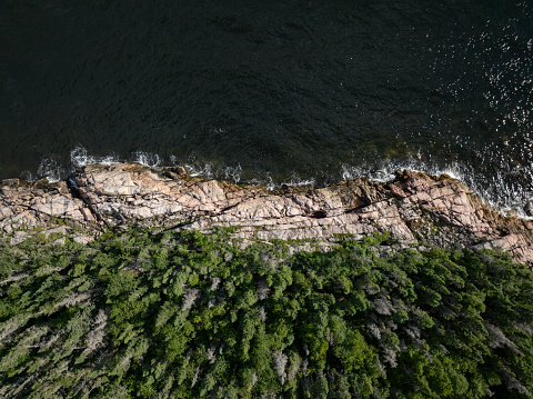 Coastal Aerial View Along Highway 138 in Cote Nord Region, Quebec, Canada During Summer. An empty beach along the St. Lawrence river showing beautiful landscapes.
