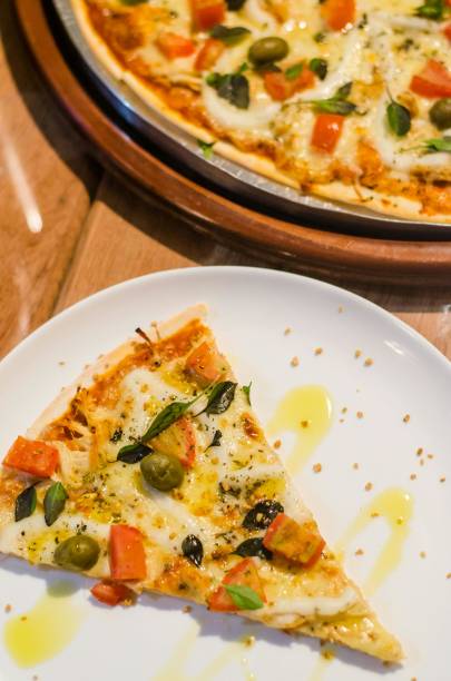 Pizza (Italian: pizza) is a savory dish from Italy, a type of round and flat dough, which is baked in the oven and usually covered in tomato sauce and cheese with other additional food ingredients that can be chosen according to taste. The cheese used is usually mozzarella or pizza cheese, it can also be parmesan and several other types of cheese.