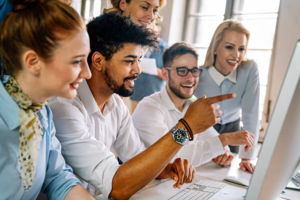 istock Group of young multi-ethnic startup business team collaborating on project in modern office 2149655285