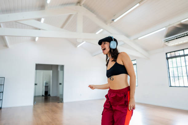istock Mid adult woman dancing on dance studio 2149655562