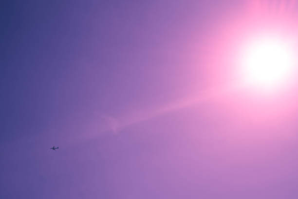 abstract background, gradient, purple light, small airplane, clear sky