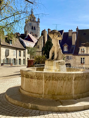 France - Dole village- Place aux Fleurs ( flower’s place) and fountain with boy statue