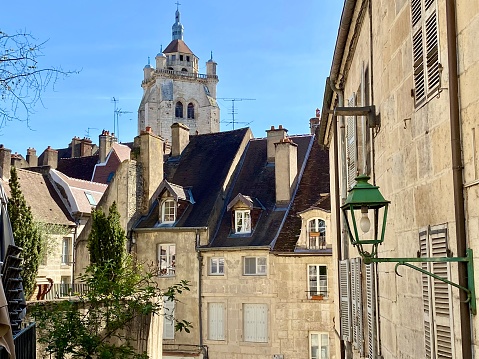 France - Dole village - little street in the old town and architecture and Collégiale Notre-Dame de Dole in the background