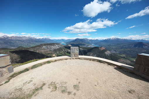Belvedere with 3 orientation tables which offers us a superb view of Lake Serre-Ponçon, Durance and Ubaye valleys, with the surrounding peaks.\nImage taken from the east