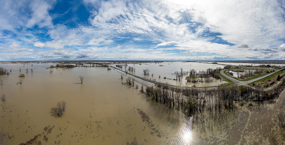 Flooded Fields and road in springtime after heavy rain. Located in St-Barthélemy and Maskinongé, Quebec, Canada close to Highway 40 (Autoroute Félix Leclerc)