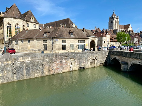 France - Dole village - architecture of the old town and water channel with green water