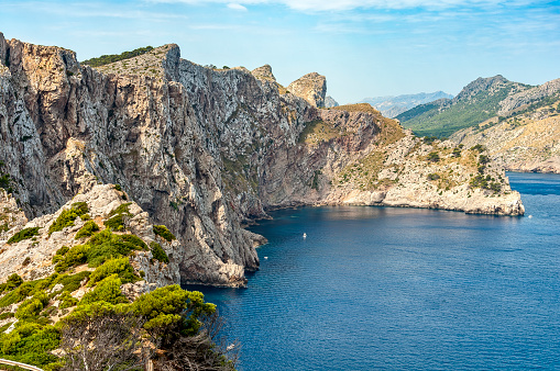 Rugged cliffs falling steeply into the sea on Cap Formentor, the northernmost tip of the Balearic island of Mallorca
