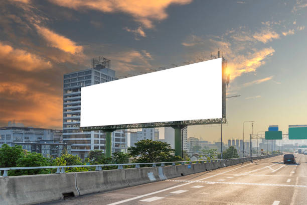 istock A large billboard is on a cloudy day. The billboard is white and has no writing on it. 2149658156