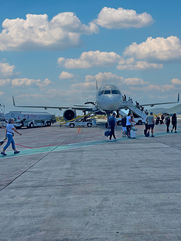Passengers Boarding an Airplane on the Tarmac at Cyril E. King Airport in US Virgin Islands on April 13th 2024.
