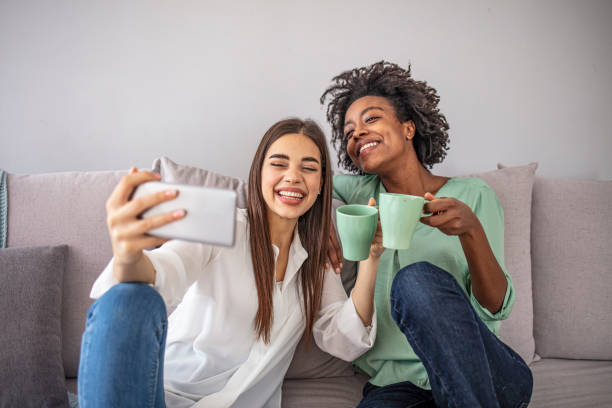 istock Two female friends taking a selfie 2149658819