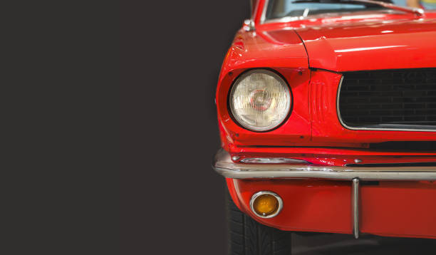 istock Front view of a vintage red car. Headlight. Classic car. Copy space. Dark background. 2149659202