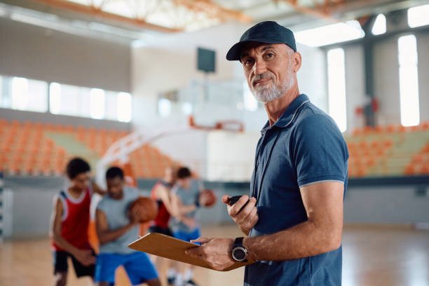 istock Mature coach during basketball practice looking at camera. 2149659986